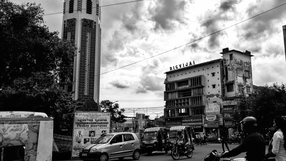 The Clock Tower in central Dehradun surrounded by shops and traffic