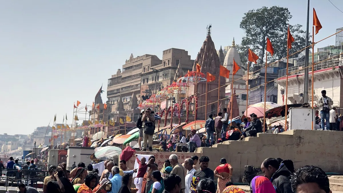 Steps of Dashashwamedh Ghat leading down to the Ganges in Varanasi with boats on the river