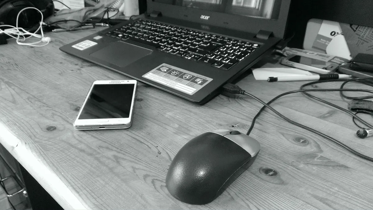 A printed invoice, a calculator and a pen on an office desk