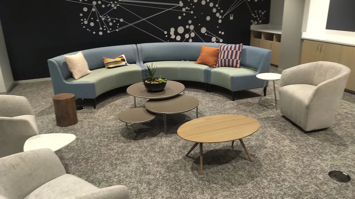 Reception desk at the entrance of a business centre with a waiting area